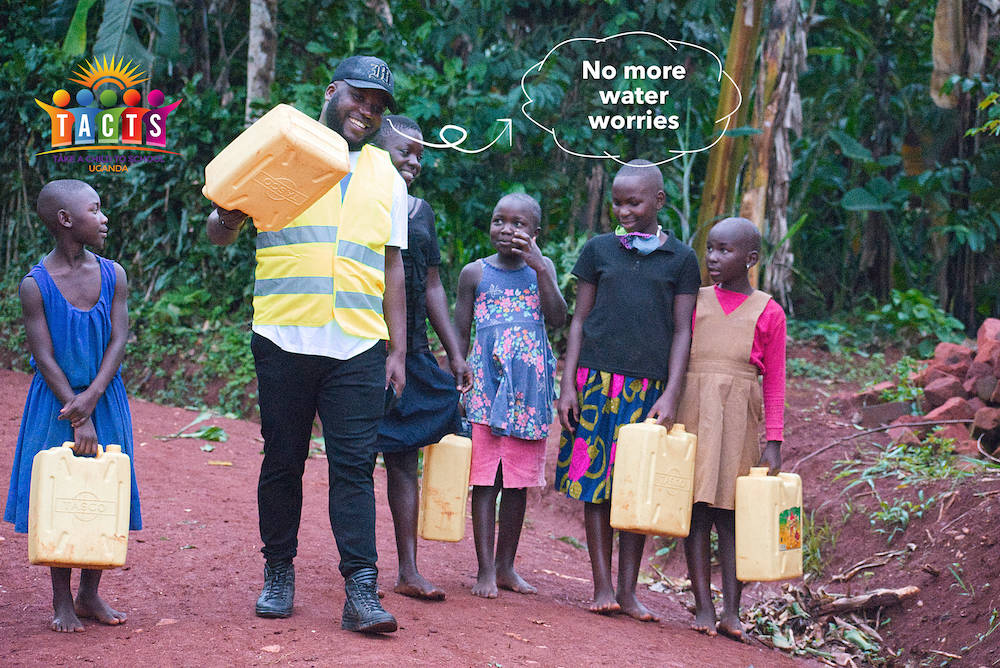 School girls carrying jerrycans with Mahad